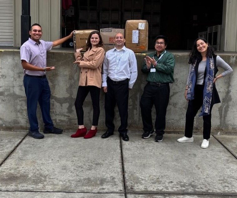 The team delivering donated boxes for a community drive