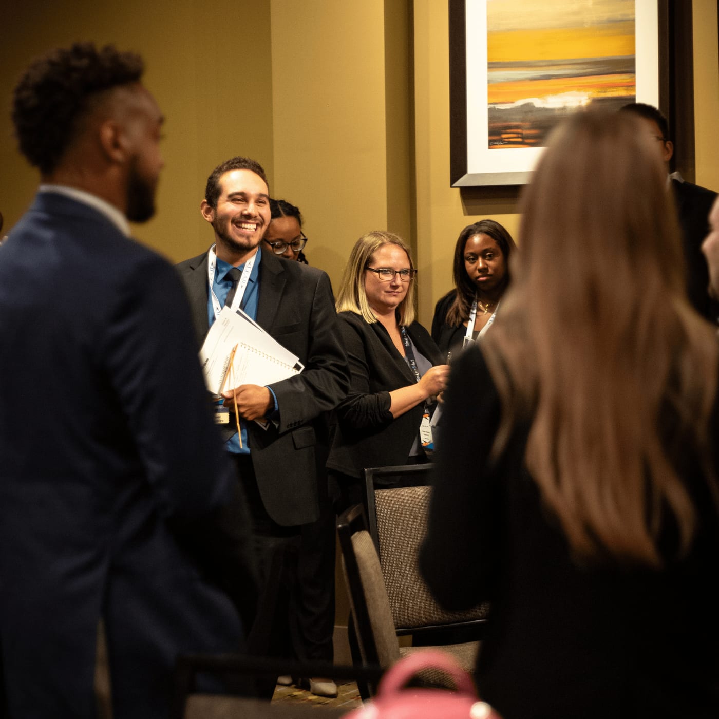 Teammates sharing a laugh between conference sessions