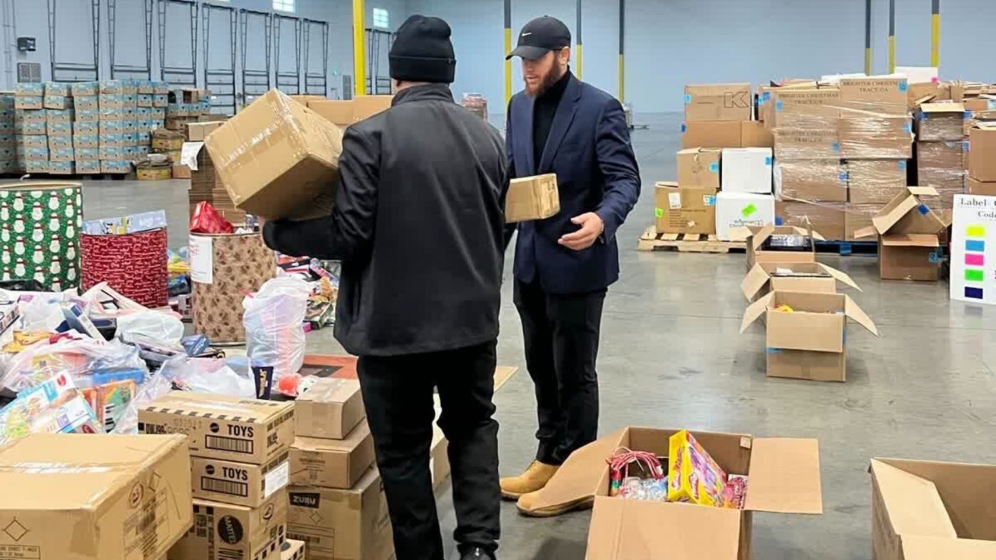 Carrying donated toy boxes